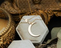 You'll be over the moon with this 14K yellow gold necklace featuring a crescent moon drop and two-star stations. The celestial piece is layered for added style. NECKLACE DETAILS: Millimeter: 0.80 Gauge: 025 Closure: Lobster Average Weight (g): 3.25 Chain Length: 18 Inches Available in: 14K Yellow Gold ***These necklaces have a 4-week lead time. If you need your necklace sooner than that, please contact us prior to ordering to verify if that's possible.*** | Crescent Moon Necklace With Star Stations In 14K Yellow Gold Ring - by Staghead Designs - Unisex Yellow Gold Crescent Jewelry With Star Charm, Crescent Yellow Gold Jewelry With Star Charm, Crescent Shaped Yellow Gold Jewelry With Star Charm, Moon Drop, Staghead Designs, 14k Yellow Gold Necklace, Yellow Gold Necklace, Crescent Moon Necklace, Average Weight