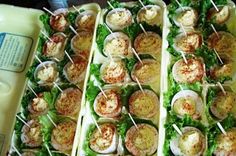 several trays filled with different types of food