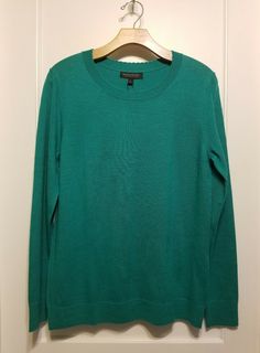 Banana Republic Merino Scallop Crew Pullover, Green, Size L, NWT Color: Emerald Green. Pictures with blue sweater used here just for example. See separate listing. Semi-fitted. Hits at the hip. Classic pullover sweater with a feminine touch. Scallop crew neck. Long sleeves. #582000 100% Extra-Fine Merino Wool. Hand wash cold. Imported.Approximate measurements, item laid flat: chest 19", length 26.5". Final sale. No returns please. From a clean, smoke and pet free environment.  Thank you! Green Crew Neck Sweater For Workwear, Green Crew Neck Knit Top, Green Stretch Sweater In Fine Knit, Green Fine Knit Stretch Sweater, Green Stretch Fine Knit Sweater, Fitted Green Fine Knit Sweater, Green Stretch Long Sleeve Top With Crew Neck, Green Fine Knit Crew Neck Top, Green Crew Neck Knit Top For Layering