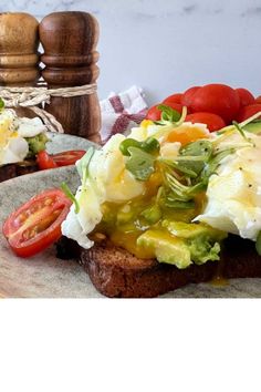 an open face sandwich with tomatoes, lettuce and mayonnaise on it