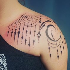 a woman's upper arm with an intricate design on it