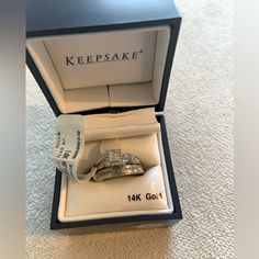 an open box with two wedding rings in it