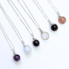 This elegant twist wire wrapped crystal necklace, available in sterling silver and 14k gold filled, features obsidian, moonstone, amethyst, aquamarine, garnet, and strawberry quartz.  💐𝐃𝐄𝐓𝐀𝐈𝐋 * Handmade item * Gemstones: Amethyst, Aquamarine, Garnet, Moonstone, Gold Sheen Obsidian, Strawberry Quartz, all 8mm round * Sterling Silver: 1.3mm Flat Cable, available in 16",  18" or 20" length  * 14K Gold Filled: 1.3mm Flat Cable, available in 16", 18" or 20" length 💎𝑨𝒎𝒆𝒕𝒉𝒚𝒔𝒕 - It is kn Sterling Silver Pendant Crystal Necklace With Gemstone Beads, Sterling Silver Crystal Necklaces With Gemstone Beads, Elegant Amethyst Necklace Hand Wrapped, Elegant Hand Wrapped Amethyst Necklace, Silver Crystal Necklace With Gemstone Beads, Silver Crystal Necklace With Gemstone Beads And Round Pendant, Minimalist Wire Wrapped Crystal Necklaces For Healing, Silver Crystal Necklace With Round Gemstone Pendant, Adjustable Sterling Silver Crystal Necklace With Gemstone Beads