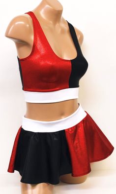 a female mannequin wearing a red top and black skirt with white trims