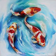 two koi fish are swimming in the water with blue and white paint on it