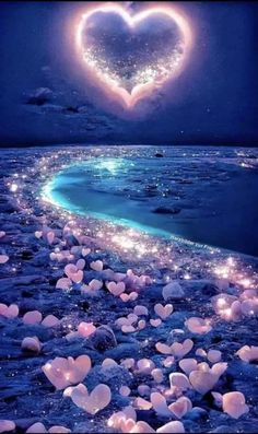 there are many hearts floating in the air on the beach at night with words good night