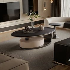 a living room with two couches and a coffee table in it's center