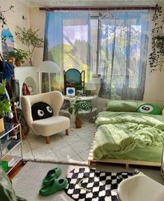 a bedroom with green and white decor in it