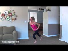 a woman in pink shirt and black leggings dancing