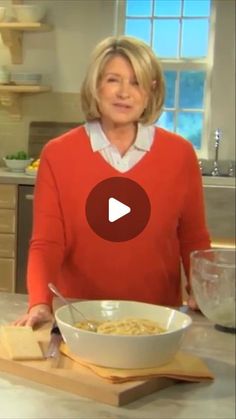 a woman standing in front of a bowl of food