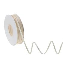 a spool of white electrical wire with a coil attached to the end of it