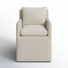 a white chair sitting on top of a white floor