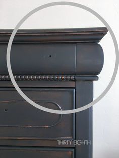 an old dresser has been painted black