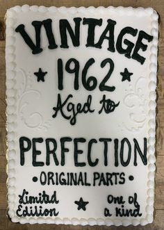 a white cake with black writing on it that says vintage 1932 aged to perfection original parts