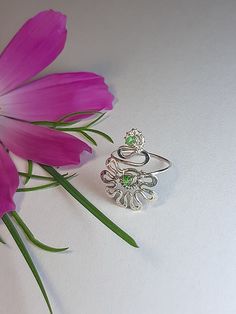 Flower toe ring. Delicate ring for fingers or toes--petite flower. Versatile and fun. Wear it as a foot ring with flip-flops or strappy heels. Wear it as a midi ring between your knuckles. Wear it folded and mixed with other rings to create new combinations. Choice of silver or bronze finish. Perfect little gift. The ring is made in Wire wrap technique, elements of coinage, from silver 925, copper or bronze wire with natural rhodochrosite, turquoise, malachite, and also you can order the ring with other stones, pre-negotiate with me. The ring is artificially aged chemically, polished and coated with protective varnish. The ring size is adjustable.  In the package You will receive one ring for the toe, which select from the options. Pay attention If You like thicker and more powerful rings, Adjustable Crystal Flower Ring, Adjustable Flower Ring For Spring Anniversary, Spring Anniversary Adjustable Flower Ring, Adjustable Flower Crystal Ring, Delicate Green Jewelry For Spring, Adjustable Green Flower Ring As Gift, Adjustable Green Flower Ring For Gift, Adjustable Green Flower Ring Gift, Sterling Silver Open Ring For Spring