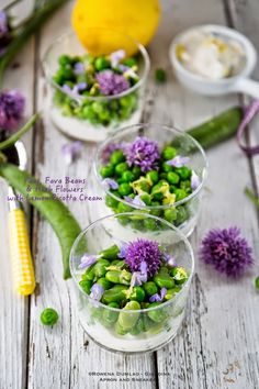 three small bowls filled with peas and purple flowers