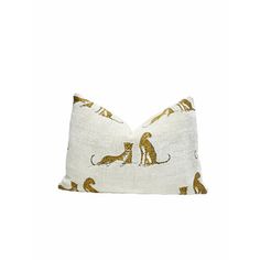 a white pillow with cats on it and gold foiling around the edges, in front of a white background