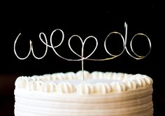 a close up of a cake with the word wedo on it's top