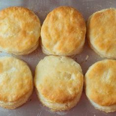 six biscuits sitting on top of a baking pan