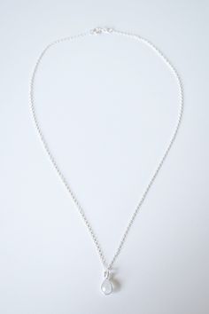 "Perfect for minimalist styling. A dainty moonstone teardrop gemstone is encircled by a sterling silver frame, and suspended on a silver necklace chain. *Free shipping for orders to USA and Canada, and no duties and customs fees.* > Comes beautifully packaged and ready for gift giving > 18\" necklace chain shown in product photo, and is our most popular necklace length > Looks lovely layered with other necklaces > Matching earrings available > Gold necklace version available in th Minimalist Teardrop Cable Chain Necklaces, Minimalist Teardrop Necklace With Cable Chain, Minimalist Teardrop Cable Chain Necklace, Minimalist Teardrop Necklaces With Cable Chain, Minimalist Charm Necklace With Teardrop Pendant, Minimalist Teardrop Pendant Charm Necklace With Adjustable Chain, Minimalist Nickel-free Necklace With Oval Pendant, Minimalist Charm Necklace With Heart Pendant, Minimalist Nickel-free Oval Pendant Necklace