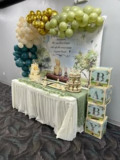 a table topped with balloons and cake