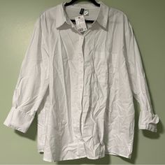 This White Button Down Shirt From H&M Is Available Now Brand New With Tags! This Shirt Is A Bright White With White Buttons And Cuffed Sleeves. This Shirt Is Part Of Their Divided Collection And Is Available Now In A Women’s Xl. Willing To Negotiate! Approximate Measurements: - Armpit To Armpit: 26.5 Inches - Shoulder To Hem: 27 Inches White Button-up Top With Roll-up Sleeves, H&m Button-up Blouse With Button Closure, H&m Relaxed Fit Shirt With Buttons, H&m Tops With Button Closure For Daywear, H&m Spring Button-up Shirt, H&m Collared Shirt With Button Closure, Classic Button-up Tops By H&m, Classic Button-up Blouse By H&m, Classic Button-up H&m Tops