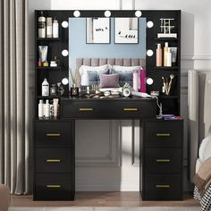 a bedroom with a vanity, mirror and lights on it's shelves in front of a bed