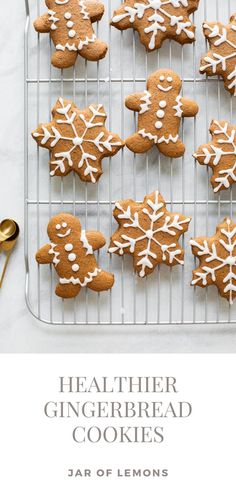 gingerbread cookies with white icing on a cooling rack