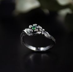 "The design of the ring in the form of a branch with leaves and a stone looks great on both women's and men's fingers. As a pair, these rings will become excellent engagement rings at your wedding, as well as a birthday present or just as a sign of attention and respect for the person. Leaves - a thirst for life \"Live life to the fullest, and do not deny yourself anything\" DETAILS: Stone - 2.5mm Metal - recycled solid Sterling Silver Finish - oxidized HOW TO ORDER ▪ Simply choose your ring siz Nature-inspired Emerald Ring For May Birthstone Gift, Nature-inspired Ring With May Birthstone For Gift, Gift Nature-inspired Emerald Ring For May Birthstone, Fine Jewelry Flower Ring For May Birthstone, Handmade Nature-inspired Emerald Ring For Anniversary, Nature-inspired White Gold Flower Ring, Emerald Flower Jewelry For Gifts, Nature-inspired Emerald Rings For Gift, Handmade Green Flower Ring For Weddings