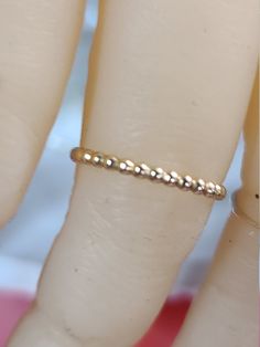 This is our Bead thumb or finger ring which looks great by itself or added to others as a stacked combination. 14k gold fill or Sterling Silver. Looks great as Midi, Pinky or even your small toe. There is just something classy yet edgy about wearing a Thumb Ring. It is such an attractive compliment to your hand, and really polishes off your look. For THUMBS most people wear between a size 8 - 10 54 millimeters = size 7 56 millimeters = size 7.5 57millimeters = size 8 58 millimeters = size 8.5 60 Beaded Toe Rings For Wedding, Dainty Tiny Rings For Jewelry Making, Adjustable Tiny Toe Rings, Minimalist Rings With Tiny Beads For Gift, Minimalist Tiny Beads Rings As Gift, Anniversary Beaded Round Ring, Adjustable Hypoallergenic Midi Rings, Adjustable Dainty Rings With Round Beads, Adjustable Beaded Rings For Promise