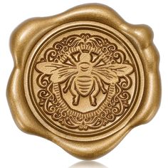 a waxed stamp with a bee on it's side and ornate designs in the middle