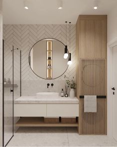 a bathroom with a sink, mirror and shower stall in it's center area