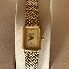 Vintage Citizen Quartz Gold Watch 1980’s Textured / Embossed Gold Plated Bracelet With Fold Over Clasp Tank Style Watch - Face Is 1/2” Wide And 5/8” Height Movement: Quartz Assembled: Frankfurt Germany Case Material: Stainless Steel Vintage: 1985 Size: 6 ½” (Adjust To 6 ¾” Larger, If Needed) Can Easily Be Sized Down Too Gently Worn And In Good Working Condition! Does Not Come In The Original Box. Beautiful Addition To Your Watch Collection! Petite, Classic, Sophisticated Yet Understated. Not Shi Gold Vintage Watch, Tank Watch, Frankfurt Germany, Citizen Watch, Vintage Tank, Style Watch, Gold Plated Bracelets, Watch Faces, Watch Collection