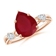 an oval shaped ruby and diamond ring with two pears on the band, set in 18k rose gold