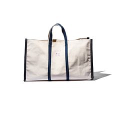 Introducing our versatile Market Tote Bag, made using repurposed materials from tent and sunshade factories. The durable yet affordable design is stylish, eco-friendly, and one-of-a-kind. "In a town in India, all the laborers who walked by use this bag made from unusual pieces of material from factories that make tents and sunshades. The bag is quite useful since it is made from such durable material while still being affordable. Speed was prioritized in the making of this bag so the stitches ar Eco-friendly Canvas Travel Bag With Reinforced Handles, Rectangular Recyclable Canvas Bag For Travel, Recyclable Rectangular Canvas Travel Bag, Reversible Eco-friendly Canvas Travel Bag, Eco-friendly Reversible Canvas Travel Bag, Everyday Upcycled Bag From Recycled Materials, Recyclable Canvas Shoulder Bag For Travel, Upcycled Canvas Tote Bag For Travel, Recycled Material Travel Tote Bag