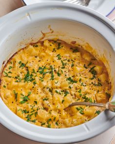 a white bowl filled with macaroni and cheese