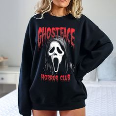 Scary Ghostface Black Halloween Shirt that is available as a Hoodie, Sweatshirt or TShirt for women, men, teens and pre-teens. Its available in all-inclusive sizing from Youth Smalls to Adult Plus Sizes, so that everyone gets a great fit. We now use a process to print our shirts that will allow the design to last longer if properly cared for, over 40 washes. In order to provide quick turnaround, we source from four different top clothing brands. If you are needing a specific brand, check with us Oversized Hip Hop Tops For Halloween, Halloween Hip Hop Sweatshirt With Letter Print, Hip Hop Halloween Sweatshirt With Letter Print, Hip Hop Halloween Long Sleeve Tops, Spooky Black T-shirt For Winter, Hip Hop Long Sleeve Halloween Tops, Halloween Grunge Hoodie With Crew Neck, Halloween Grunge Crew Neck Hoodie, Hip Hop Long Sleeve Tops For Halloween