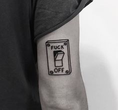 a person with a black and white tattoo on their arm