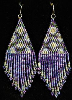 "Here are beautiful flowery beaded earrings. They are a fringe style and I have them in five different colors. There is navy blue with peach, purple, clear with blue, red, and navy with bronze. All are equally nice. They measure 2.5\" long and hang on stainless steel ear wires." Elegant Multicolor Beaded Earrings With Fringe, Purple Beaded Fringe Earrings As Gift, Purple Beaded Fringe Drop Earrings, Purple Fringe Beaded Earrings As Gift, Purple Fringe Beaded Earrings For Gift, Purple Earrings With Beaded Fringe, Elegant Multicolor Beaded Fringe Jewelry, Elegant Multicolor Jewelry With Beaded Fringe, Purple Jewelry With Beaded Fringe And Round Beads