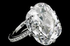 JAR Paris. EXCEPTIONAL DIAMOND RING. Claw-set with a round-cornered rectangular modified brilliant-cut diamond weighing 11.70 carats, to a mount set with single-cut stones, mounted in platinum, signed JAR Paris, French assay and maker's marks. size 52 ½. Estimate 800,000 - 1,300,000 USD / LOT SOLD 996,319 USD. GIA / Gübelin / the diamond is D Colour, VS2 Clarity, Type IIa [S. 19 NOV. 2008] #JARParis #JoelArthurRosenthal #Sothebys Golconda Diamond, Stunning Diamond Rings, Copper Engraving, Gold C, Rare Stone, Hand Coloring, Brilliant Cut Diamond, Hyderabad, Cut And Style