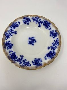 a blue and white plate sitting on top of a table