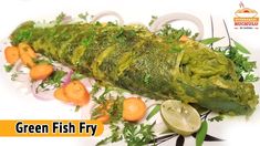 green fish fry with vegetables on a white plate