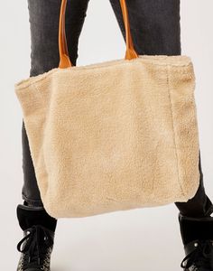 Keep your treasures warm and safe in the Sherpa Treasure Tote. Faux Leather handle, poplin-lined interior, and inner zip pocket to keep all your valuables safe. Carved Designs, Leather Handle, Zip Pockets, Faux Leather, Leather