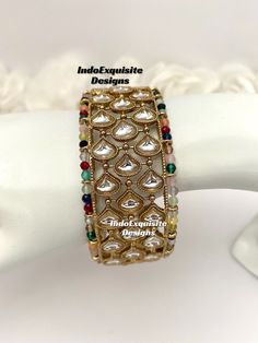 Multi color Kundan Kade/ Bracelet (Single Pc)/Indian bangles/Punjabi bangles Set/Bridal bangles/wedding jewelry/Indian Wedding jewelry/Kundan Polki bridal bangles All items are shipped from Brampton, Ontario, Canada. If you need your item by a certain day, please reach out to us for express delivery option. We kindly request to consider minor variations in colors, shades, textures as pictures displayed may slightly vary from the actual product due to digital image limitations. Please expect the possibility of some minor imperfections when buying handmade jewelry. Please contact us for any questions you might have. Thank you and Happy shopping 😊 White Bollywood Bangle For Wedding, Bollywood Style White Wedding Bangle, White Bollywood Style Wedding Bangle, White Bangle For Wedding And Diwali, White Wedding Bangle For Diwali, Multicolor Jewelry For Marriage And Festivals, White Bangle For Marriage And Festive Occasions, Elegant Multicolor Cuff Bracelet For Festive Occasions, White Festive Bangle For Marriage