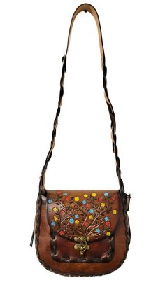 "PLEASE advise the size of the handbagEach of our handbags are individually hand crafted and hand painted in our North Carolina shop. These \"'70's\" style handbags are made from 7 ounce American Cowhide that will stand the test of time.  Includes two suede leather pockets on the inside and a key fob that attaches to the inside of the bag.  The strap is a one piece \"mystery braid\" that was popular during the '60's and '70's .  We have been making this same handbag for over 40 years, and some o 70’s Style, Handcrafted Pottery, Tooled Leather Purse, Flower Colors, Floral Handbags, Purse Gift, Hand Painted Leather, Leather Floral, Painting Leather