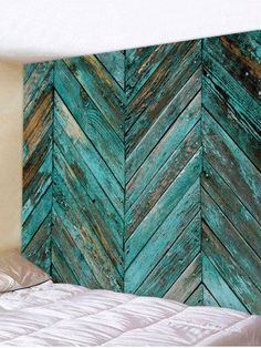 a bed sitting next to a wall made out of wooden planks in a bedroom