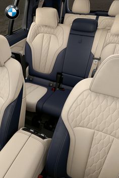 the interior of a car with blue and white seats