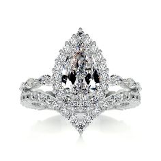 a white diamond ring with two rows of diamonds on the band and an oval shaped center stone