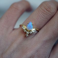 Straight from our New York workshop, the Celestial Opal Pearl ring is a one-of-a-kind magical beauty that stole our hearts. A beautiful pear-shaped Australian opal floats on three graceful pearls. Available in yellow gold, rose gold and silver, or 14K solid gold. gold vermeil or 14k solid gold Natural 7x5mm Australian opal Three natural freshwater pearls Round CZs (what's this?) ** This item is specially made for you. Please allow 1-2 week lead time. ShippingDomestic: Free standard shipping with Ethiopian Opal Ring For Wedding, Fine Jewelry Teardrop Moonstone Wedding Ring, Teardrop Moonstone Ring For Wedding, Teardrop Diamond Opal Ring For Anniversary, Elegant Teardrop Moonstone Promise Ring, Teardrop Moonstone Wedding Ring Fine Jewelry, Elegant Teardrop Moonstone Ring For Anniversary, Wedding Fine Jewelry Teardrop Moonstone Ring, Teardrop Moonstone Wedding Ring In Fine Jewelry Style