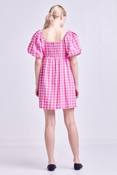 A summertime must-have, this Gingham Linen Sweetheart Baby Doll is as comfortable as it is chic. With its textured fabric, gingham print and sweetheart neckline, this mini dress is perfect for a day spent exploring the city or relaxing on the beach. The short puff sleeves and side pockets add a touch of femininity and functionality, while the lining ensures a perfect fit. For best results, hand wash cold and iron low. Textured Gingham Sweetheart neckline Short puff sleeves Mini length Side pockets Lining Shell: 50% Polyester 50% Cotton Lining: 80% Polyester 20% Cotton HN334D Total length: 35.50" Bust: 33.75" S POWDER BLUE: Height 5'8.5" / Bust 32" / Waist 24" / Hip 34" PINK: Height 5'10" / Bust 32" / Waist 24" / Hip 35" Gingham Short Sleeve Dress With Smocked Bodice, Cute Pink Mini Dress With Smocked Bodice, Short Sleeve Gingham Dress With Smocked Bodice, Gingham Dress With Smocked Bodice And Short Sleeves, Pink Ruffled Mini Dress For Picnic, Summer Gingham Mini Dress With Short Sleeves, Pink Cotton Mini Dress With Square Neck, Pink Feminine Mini Dress For Picnic, Pink Square Neck Cotton Mini Dress